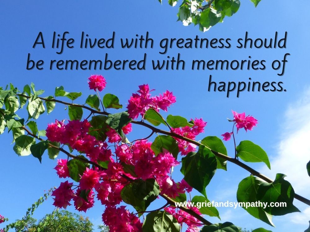 A life lived with greatness should be remembered with memories of happiness.  Quote on blue background with pink flowers.
