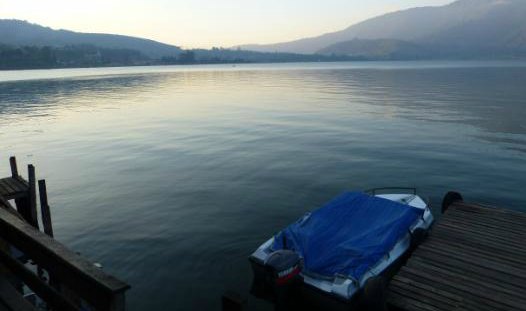 Boat on a cool blue lake expressing loneliness after loss of a wife