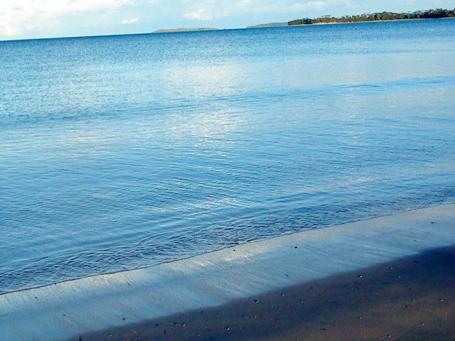 Waves on the sand - writing a name in the sand to say goodbye when someone dies