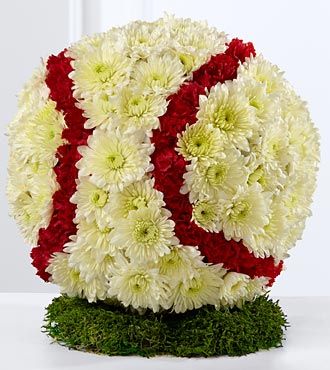 Flowers in the form of a baseball.  Chrysanthemums, yellow and red.
