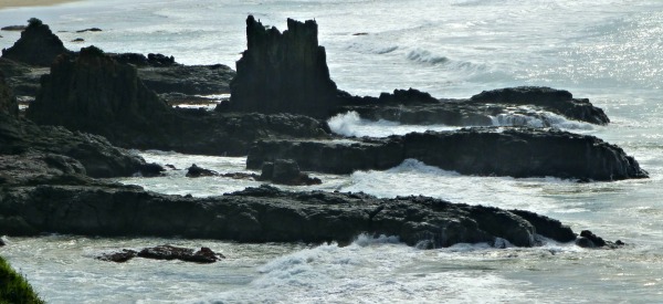 Waves Crashing on Rocks Reflecting the Stress of Elder Suicide