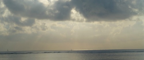 Sun shining through the clouds to illustrate grief lifting Sun shining through the clouds to illustrate grief lifting