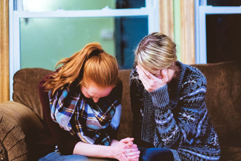 Mother and daughter grieving