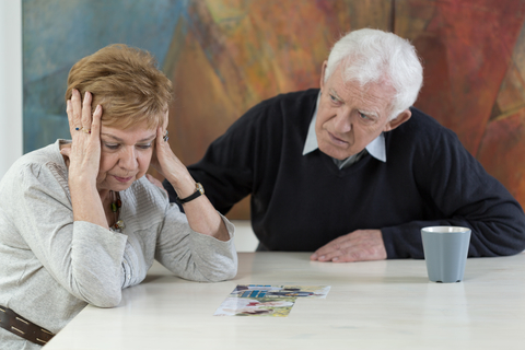 A couple looking distressed and upset.