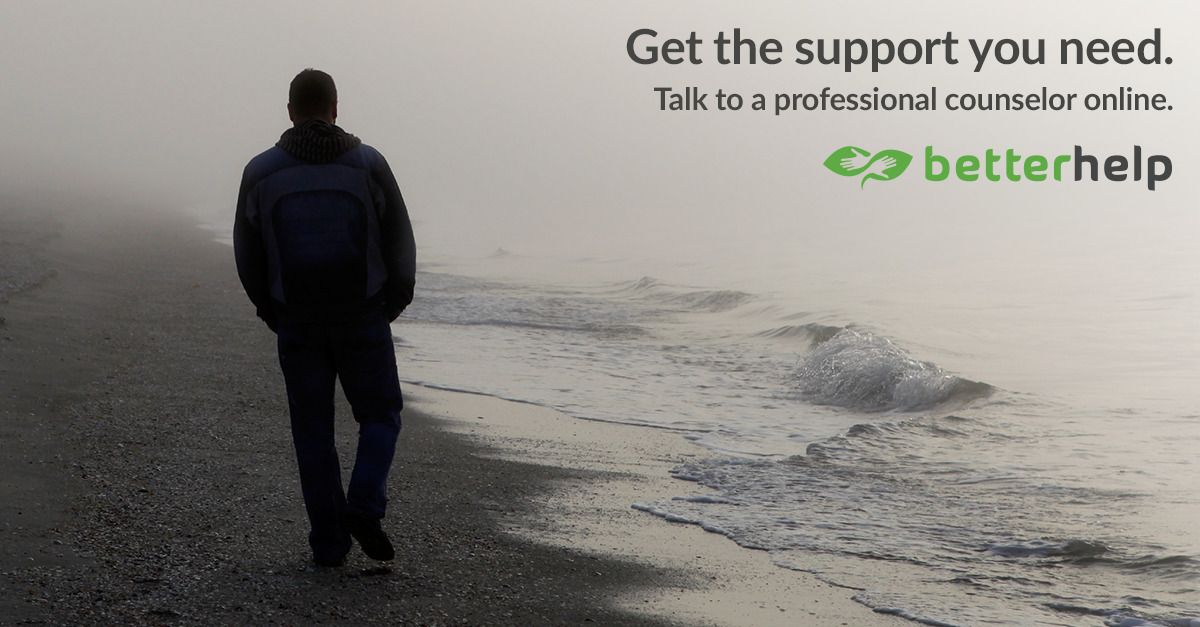 Man walking by the sea on a grey day with text "Get the support you need" .