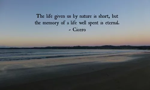 The life given us by nature is short, but the memory of a life well spent is eternal.  Cicero. Meme with seascape background.