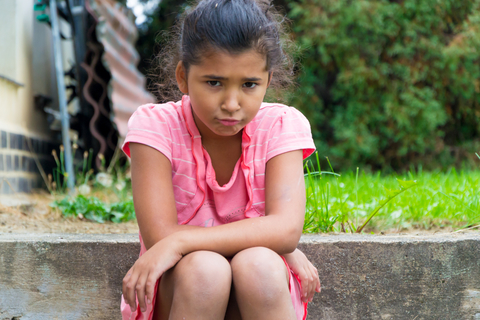 Teenage girl feeling angry, sad or frustrated when her parents get divorced.