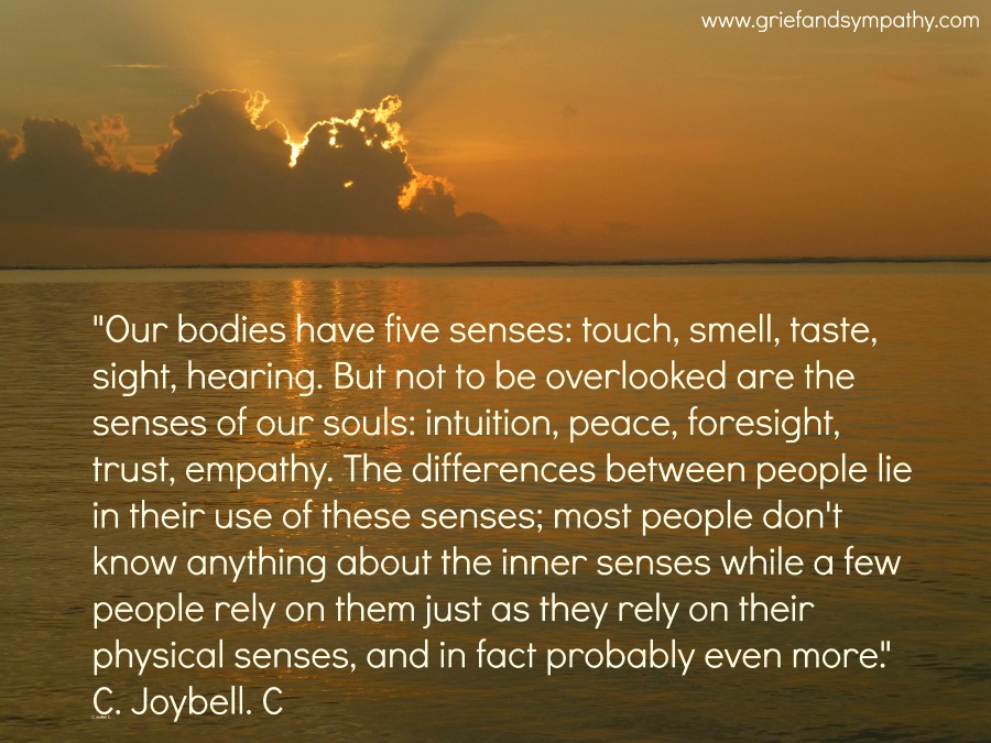 Quote about intuition, peace and empathy on sunrise background.