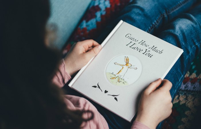 Mom reading a book to a child.  Photo by Annie Spratt on Unsplash