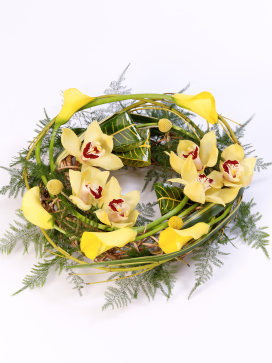 Wreath with Cymbidium orchids and Yellow Calla Lilies on a Willow Frame